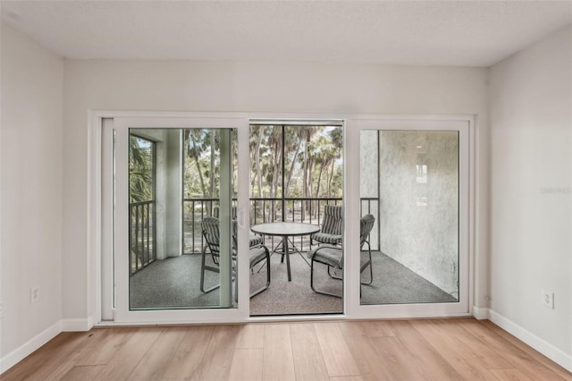 2753 Orchid Oaks Dr Unit 104, Sarasota, FL 34239 - dining room with wood finished floors and baseboards