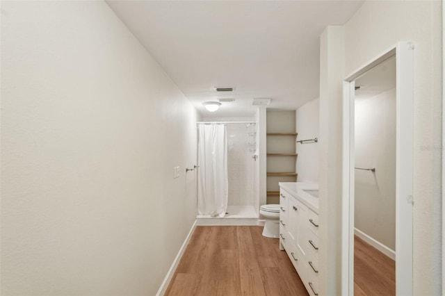 2753 Orchid Oaks Dr Unit 104, Sarasota, FL 34239 - hallway featuring light wood-style floors and baseboards
