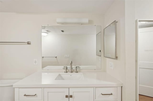 2753 Orchid Oaks Dr Unit 104, Sarasota, FL 34239 - bathroom with vanity and toilet