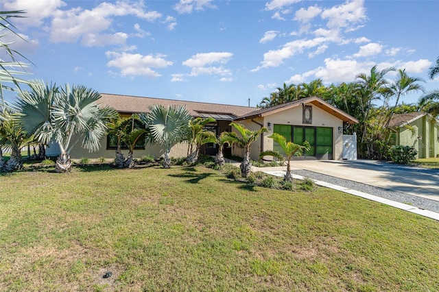 view of front facade featuring a garage and a front yard