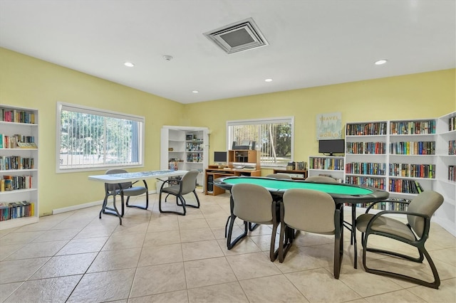 playroom with light tile patterned floors and plenty of natural light