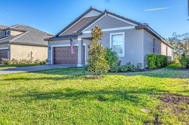 view of front facade featuring a front lawn and a garage