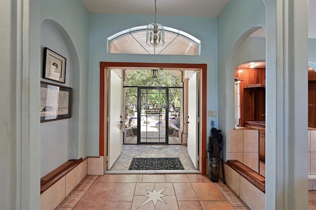 entryway with light tile patterned flooring