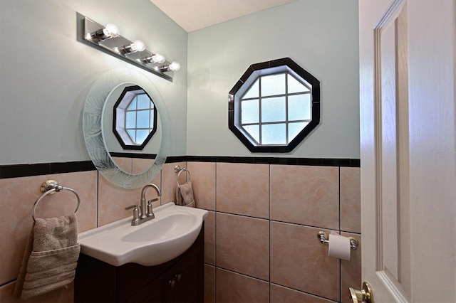 bathroom featuring vanity, tile walls, and plenty of natural light