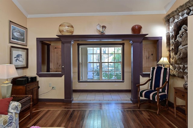 living area featuring vaulted ceiling, ornamental molding, and wood-type flooring