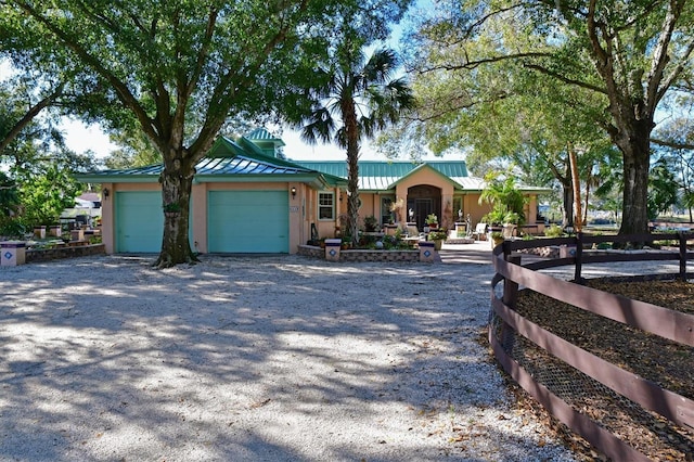 single story home featuring a garage