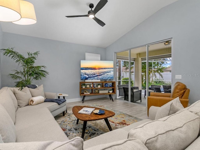 living room featuring vaulted ceiling, ceiling fan, and wood finished floors