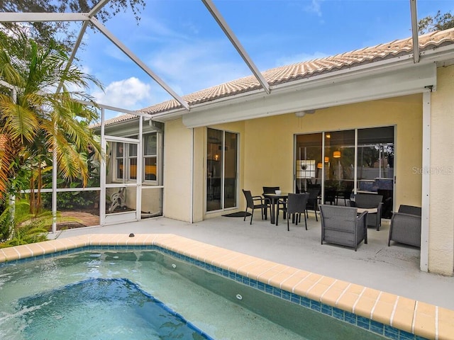 outdoor pool with a patio area