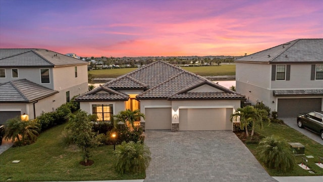 view of front of house with a lawn and a garage