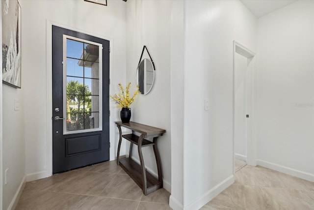 entryway with light tile patterned floors