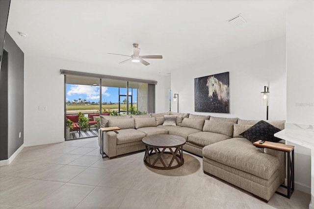 living room featuring ceiling fan and light tile patterned flooring