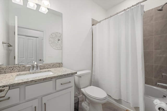 full bathroom with shower / bath combination with curtain, toilet, and vanity