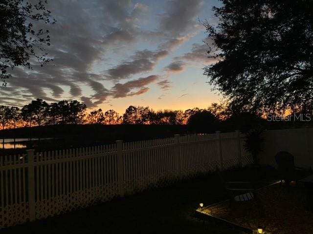 view of yard at dusk