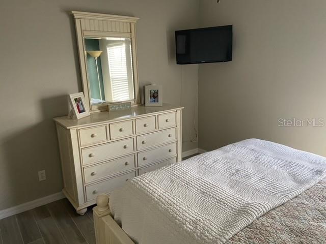 bedroom featuring dark hardwood / wood-style flooring