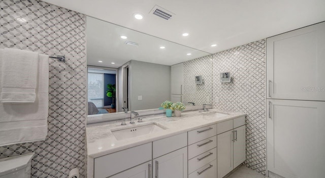 bathroom with vanity and toilet