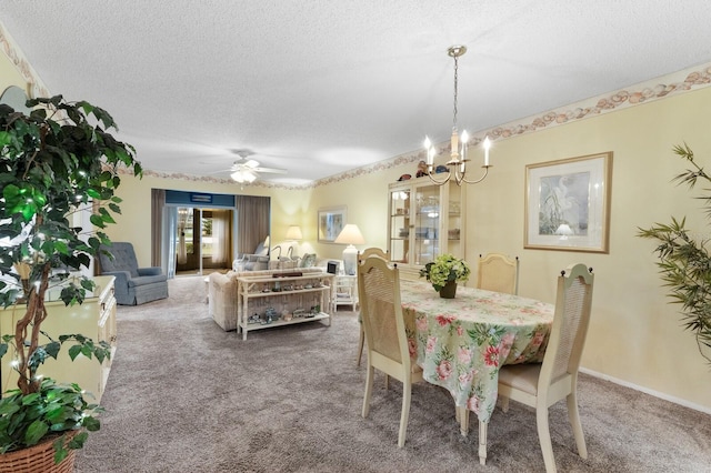 dining room with carpet, a textured ceiling, and ceiling fan with notable chandelier