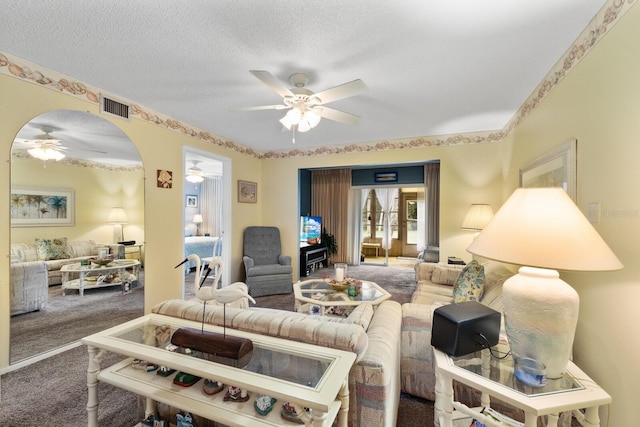 carpeted living room with a textured ceiling