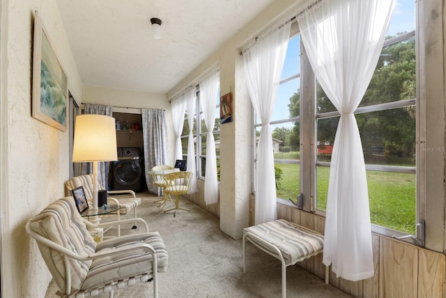 sunroom featuring washer / dryer