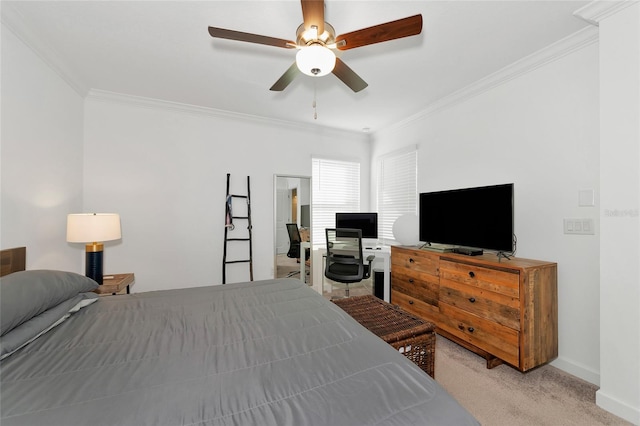 carpeted bedroom featuring ceiling fan and ornamental molding