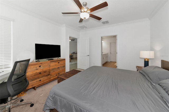 bedroom featuring ceiling fan, ornamental molding, ensuite bath, and light carpet