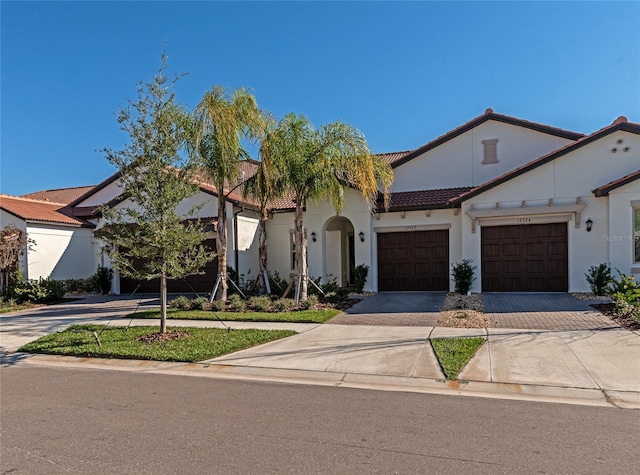 mediterranean / spanish-style house featuring a garage