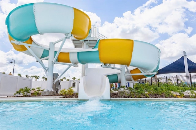 view of pool with a water slide