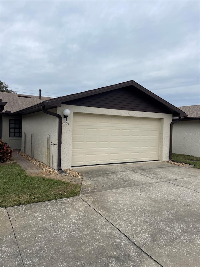 view of side of home with a garage