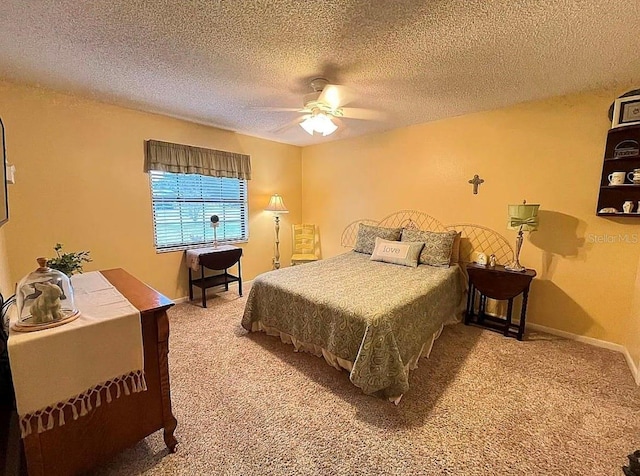 bedroom with carpet, a textured ceiling, and ceiling fan