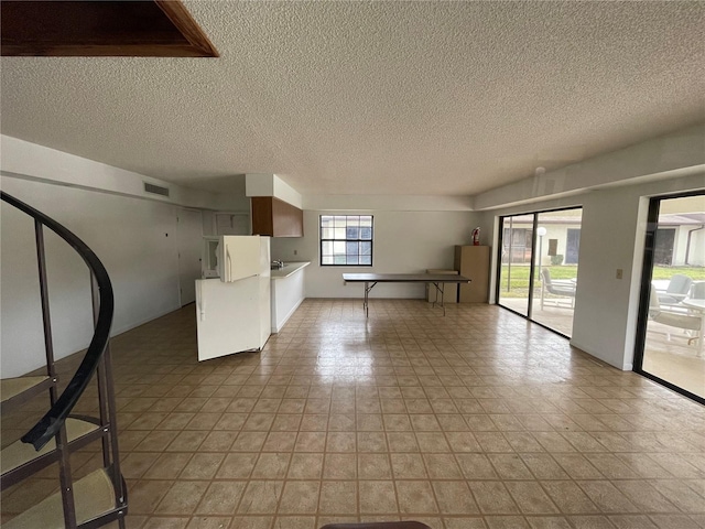 interior space featuring a textured ceiling