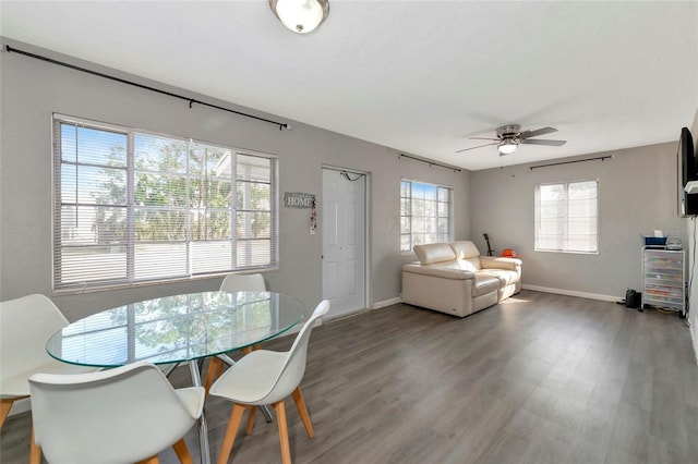 dining room with hardwood / wood-style flooring, ceiling fan, and a wealth of natural light