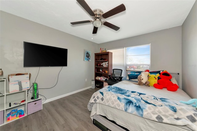 bedroom with wood-type flooring and ceiling fan