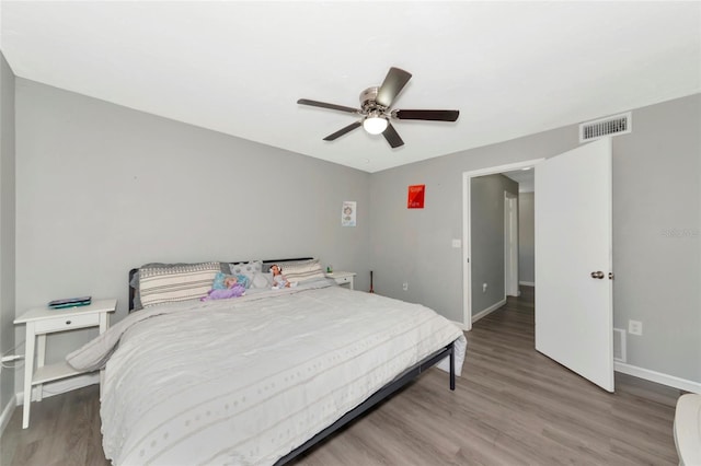 bedroom featuring ceiling fan and hardwood / wood-style floors