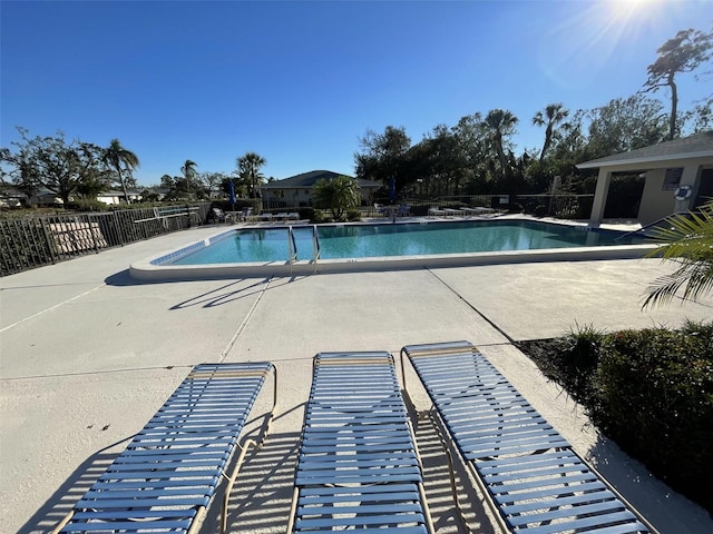 view of swimming pool featuring a patio area