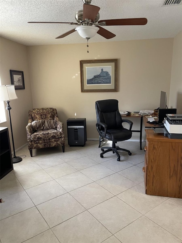 office featuring light tile patterned floors and a textured ceiling