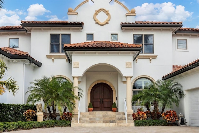 mediterranean / spanish-style house featuring a garage