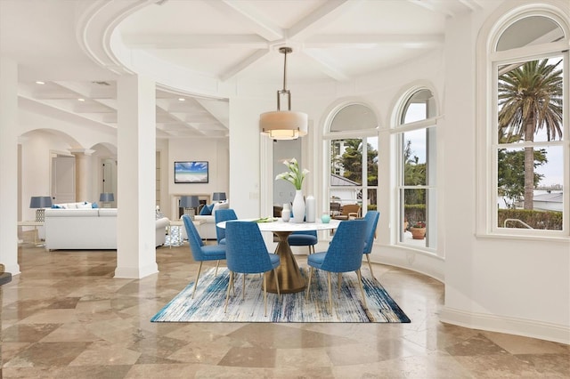 dining space with a healthy amount of sunlight, coffered ceiling, beam ceiling, and ornate columns