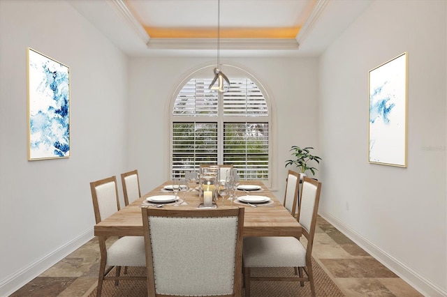 dining area with a tray ceiling