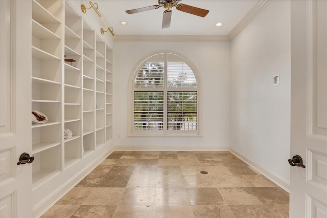 unfurnished room featuring crown molding, ceiling fan, and built in shelves