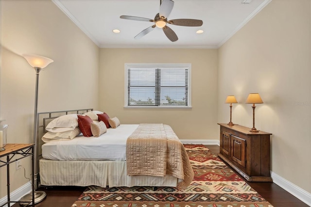 bedroom featuring crown molding, dark hardwood / wood-style floors, and ceiling fan