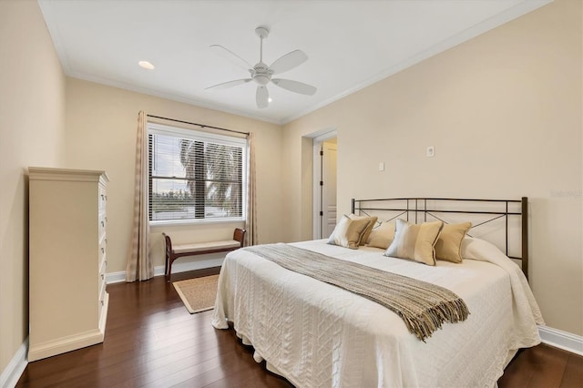 bedroom with ornamental molding, dark hardwood / wood-style floors, and ceiling fan