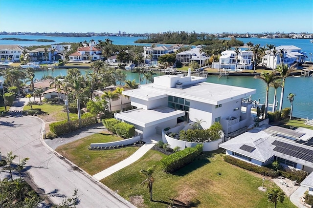 birds eye view of property with a water view