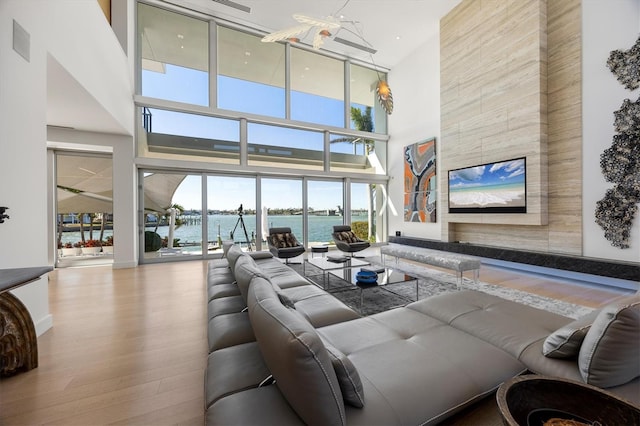 living room featuring a high ceiling and wood-type flooring