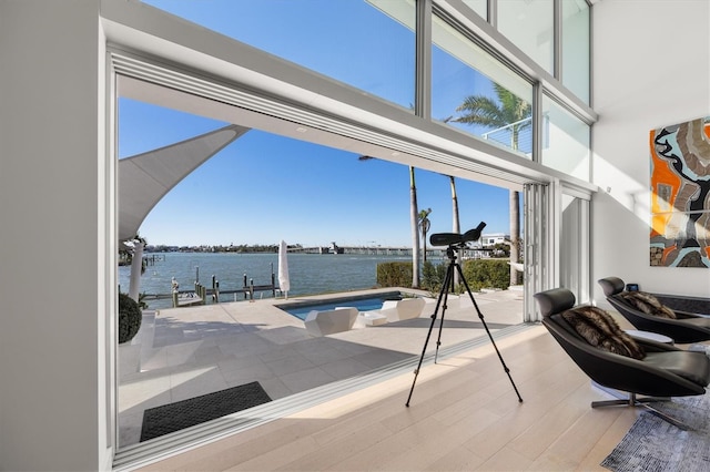 view of swimming pool with a water view