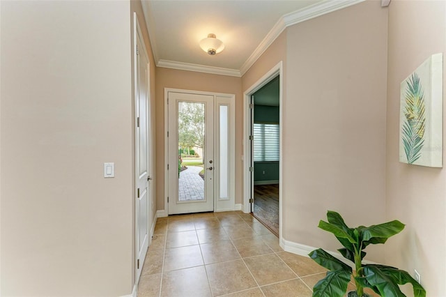 doorway to outside featuring ornamental molding and light tile patterned floors