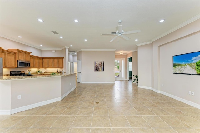 kitchen featuring light tile patterned floors, ornamental molding, ceiling fan, stainless steel appliances, and light stone countertops