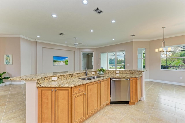 kitchen featuring pendant lighting, dishwasher, an island with sink, sink, and light stone countertops