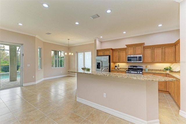 kitchen featuring stainless steel appliances, crown molding, a kitchen island with sink, and light stone counters