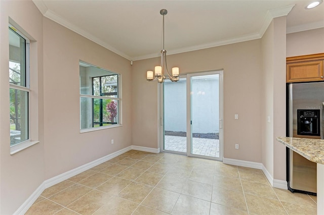 unfurnished dining area with an inviting chandelier, light tile patterned floors, and ornamental molding