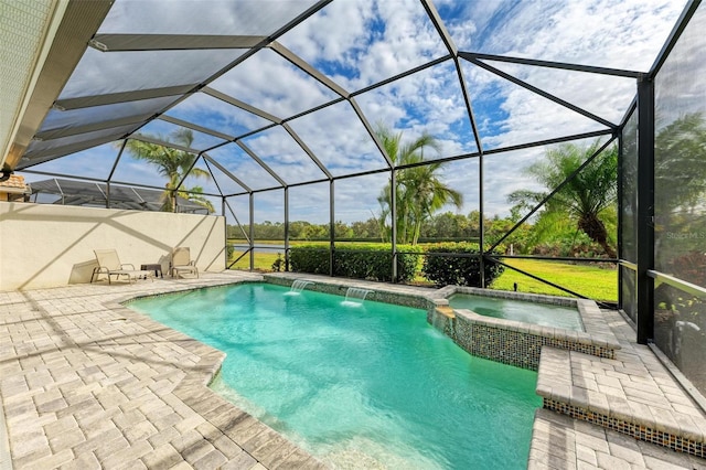 view of pool with a patio, an in ground hot tub, pool water feature, and glass enclosure