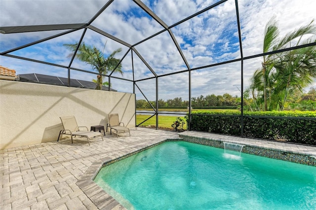 view of pool featuring a patio, a lanai, and pool water feature